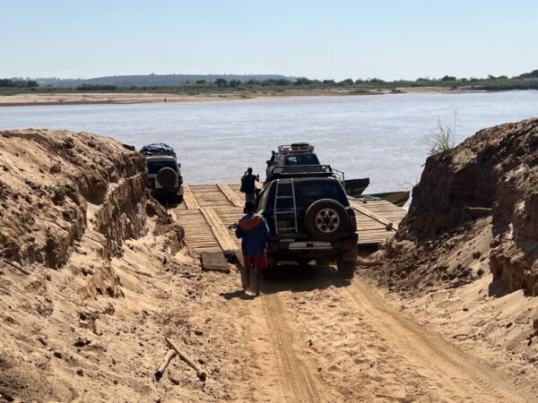 Loading our jeep on the raft