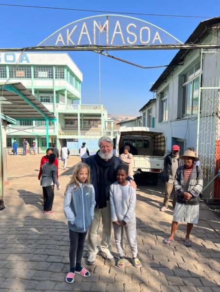 Father Pedro with Nia and local girl